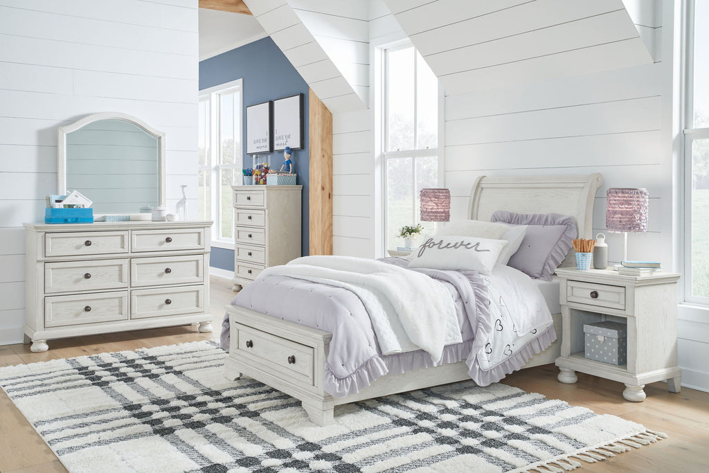 White youth sleigh bedroom set with bed, dresser, and matching nightstand
