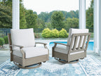 Swivel glider chair with light beige cushion and dark brown frame on outdoor patio