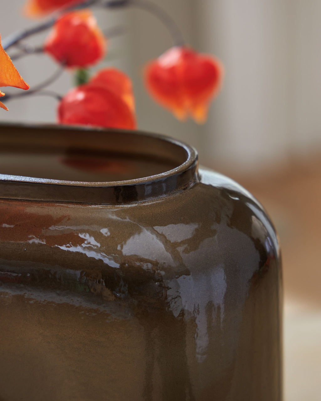 Close-up of Sumner vase rim and dark brown glossy glass with visible sheen