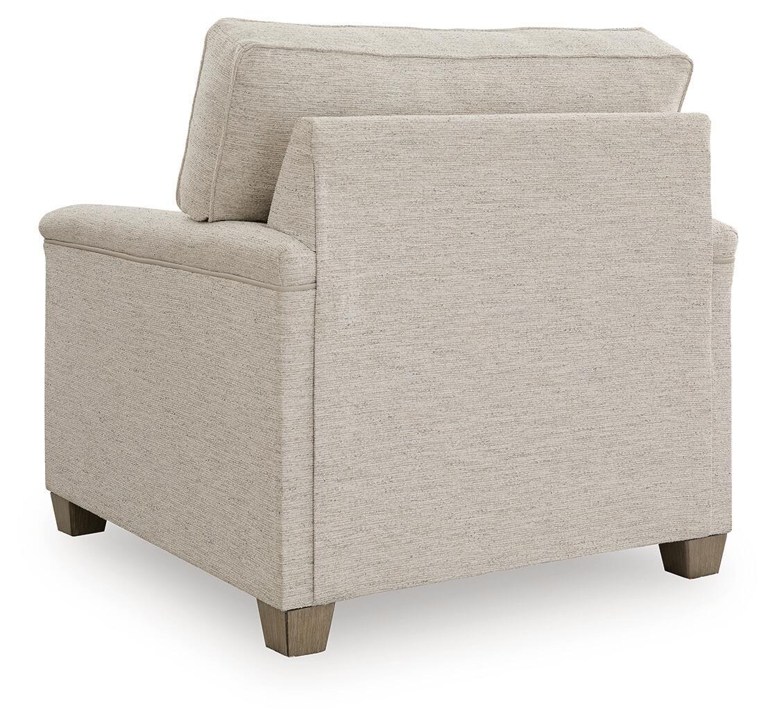 Upholstered accent chair with light beige fabric and squared side panels