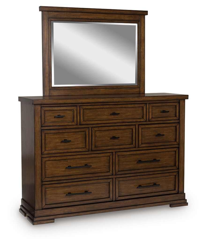 Medium brown dresser with matching mirror, six drawers and carved trim