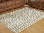 Beige Corrbell rug with abstract stripe pattern, flat-weave look.
