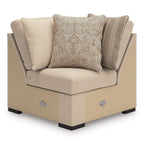 Cream upholstered sectional chaise with one corner seat and three accent cushions