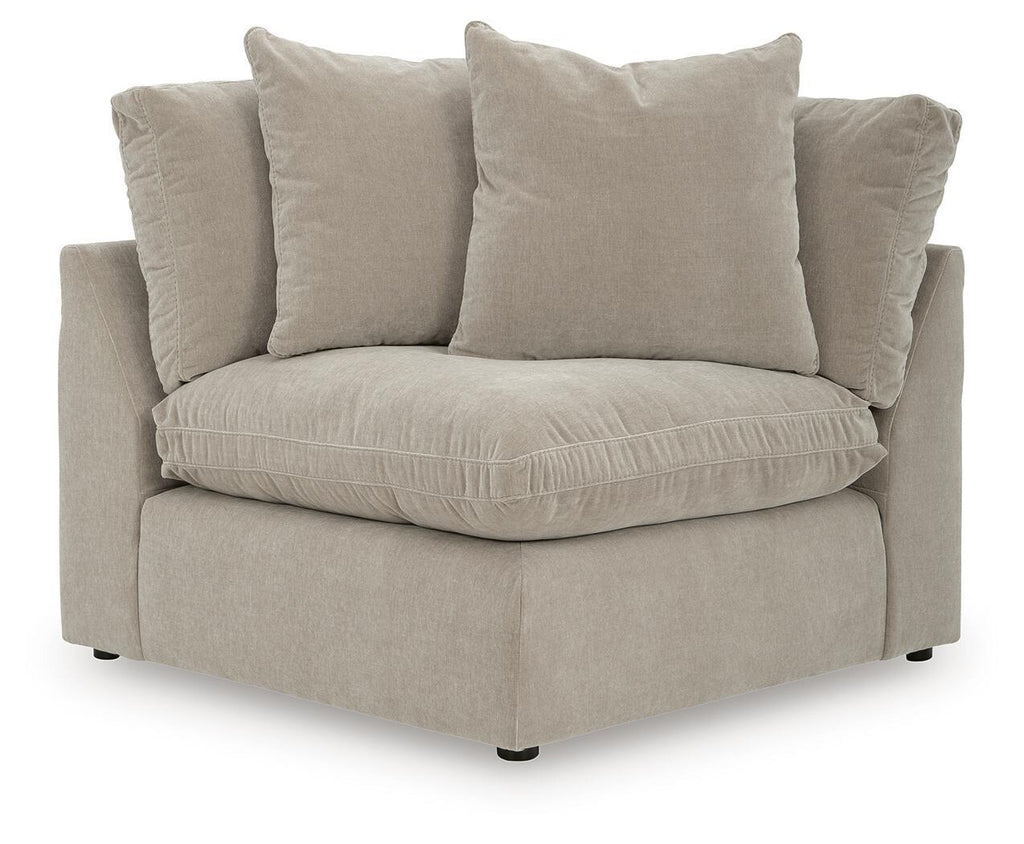 Upholstered wedge armchair in pebble beige with five seat and back cushions