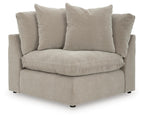 Upholstered wedge armchair in pebble beige with five seat and back cushions