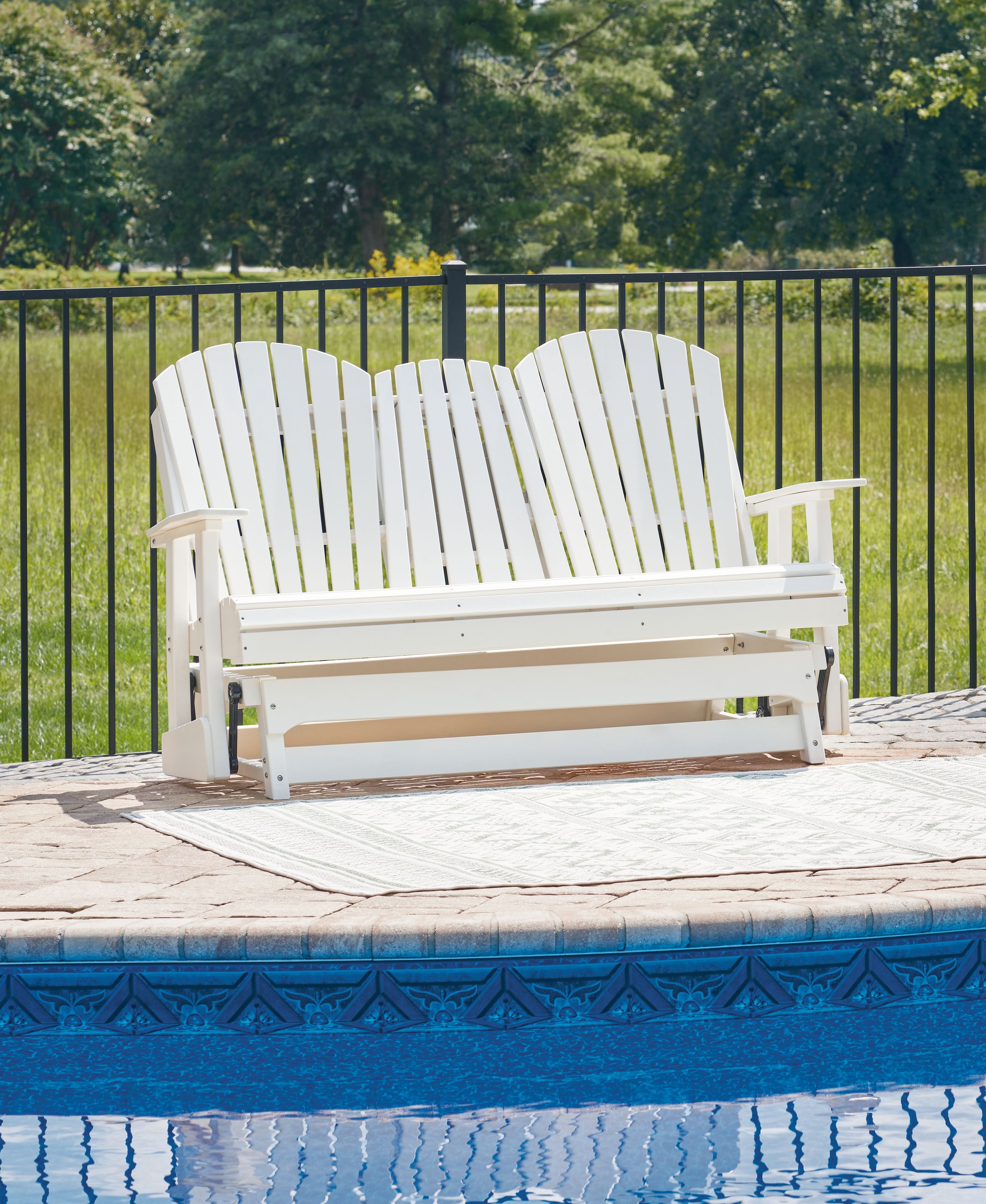 White wooden glider loveseat with slatted back and wide arms, open seat