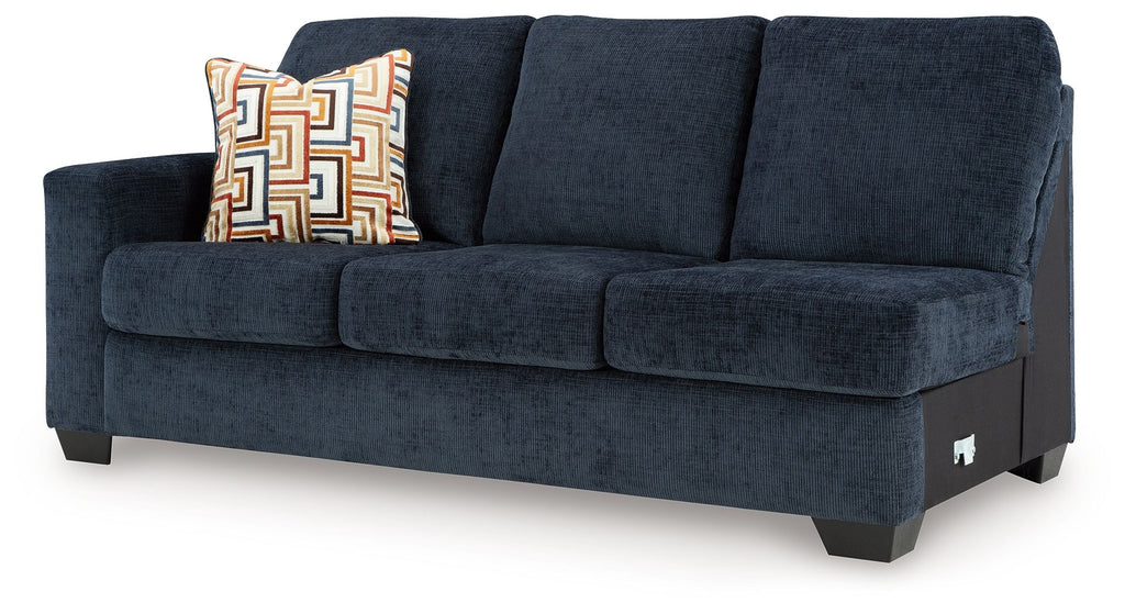 Ink blue fabric sofa side profile with square arms, three seat cushions, and throw pillow