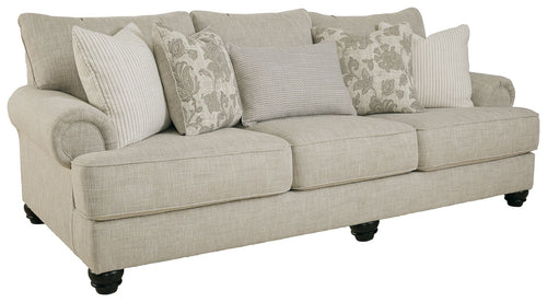 Fog sofa with rolled arms, three seat cushions, patterned pillows, dark legs