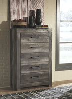 Gray five-drawer chest with dark metal bar pulls and distressed finish.