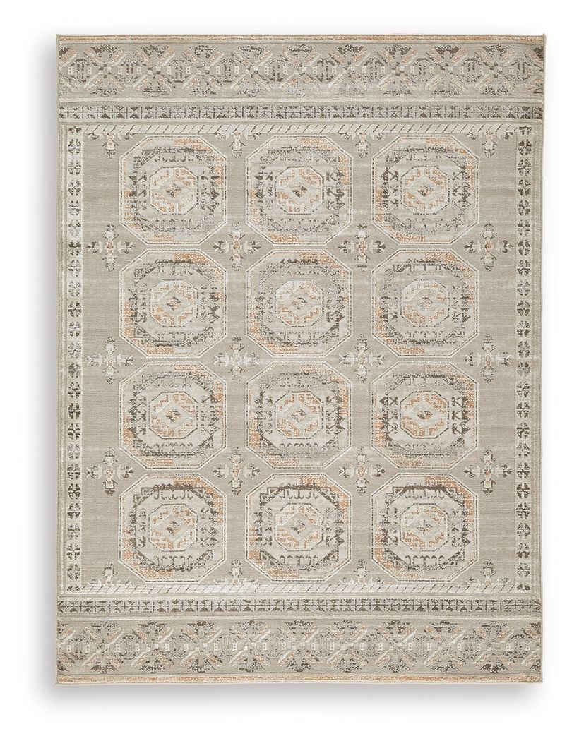 Light beige rug with repeating octagon medallions and ornate border details