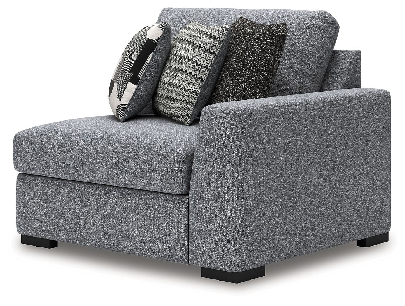 Gray corner accent chair with thick padded arms and two patterned throw pillows