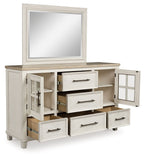 Antique white dresser with framed mirror, open compartments, and drawers