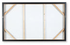 Back of framed wall art with wooden cross braces and a light backing board