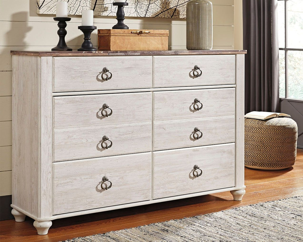 Whitewash wood dresser with six drawers and dark metal knob pulls, turned bun feet