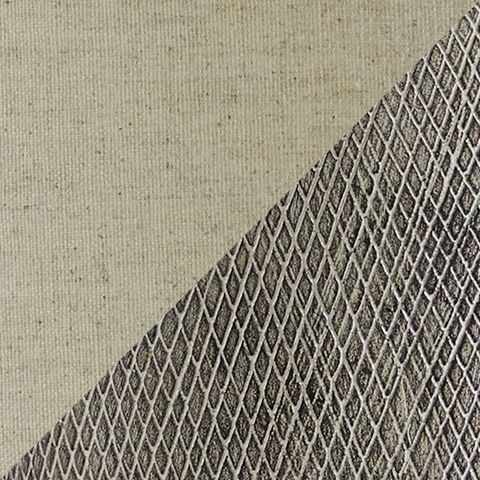 Close-up of textured dark gray ceramic lamp base with woven pattern