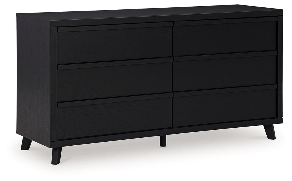 Black panel dresser with multiple drawers and sloped legs