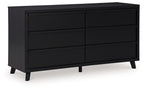 Black panel dresser with multiple drawers and sloped legs