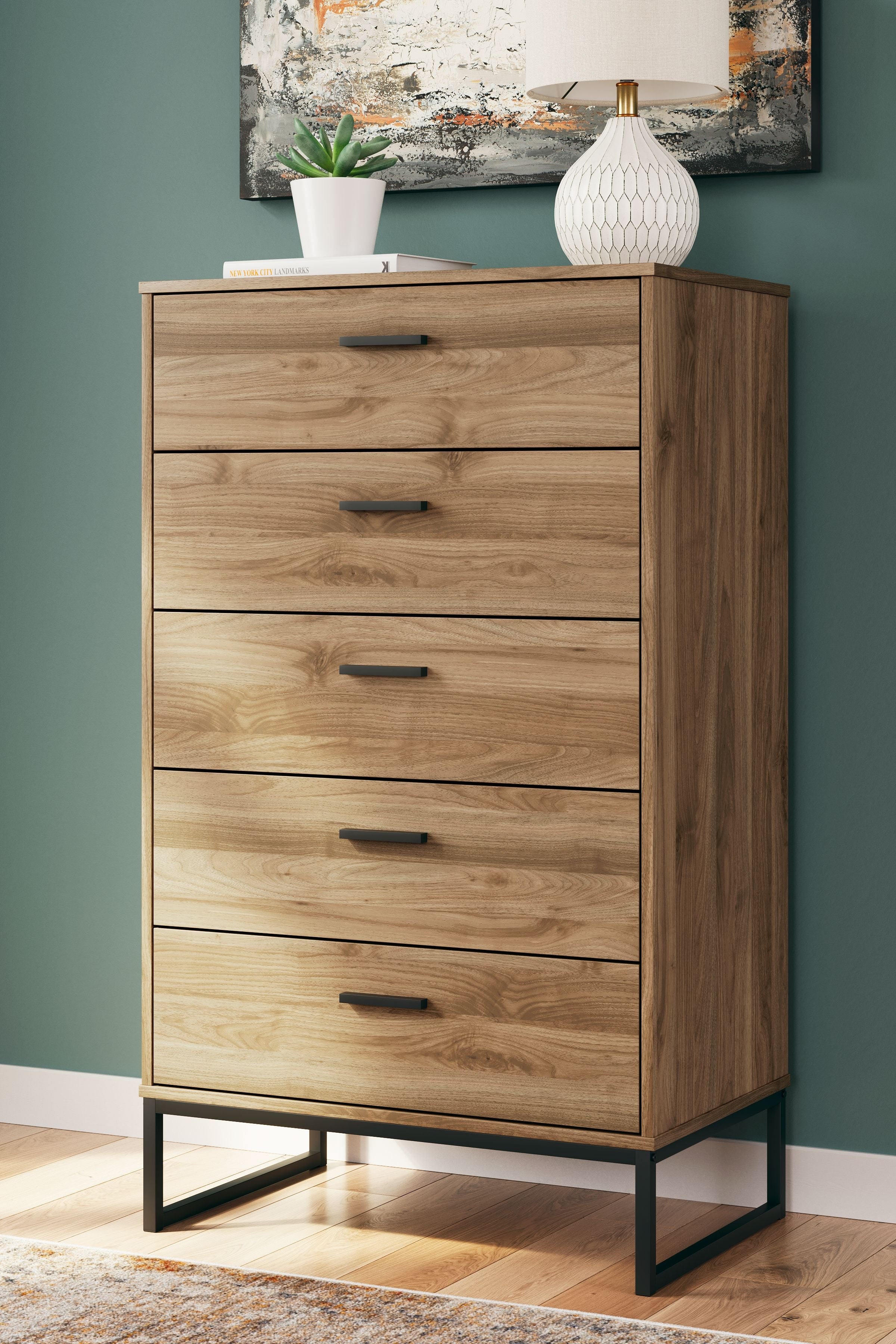 Honey wood five-drawer chest with black legs and bar drawer pulls
