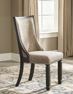 Dark gray upholstered dining chair with curved back and wood legs