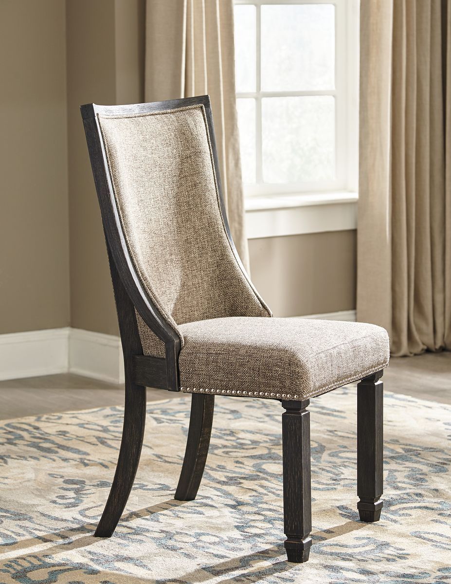 Dark gray upholstered dining chair with curved back and wood legs
