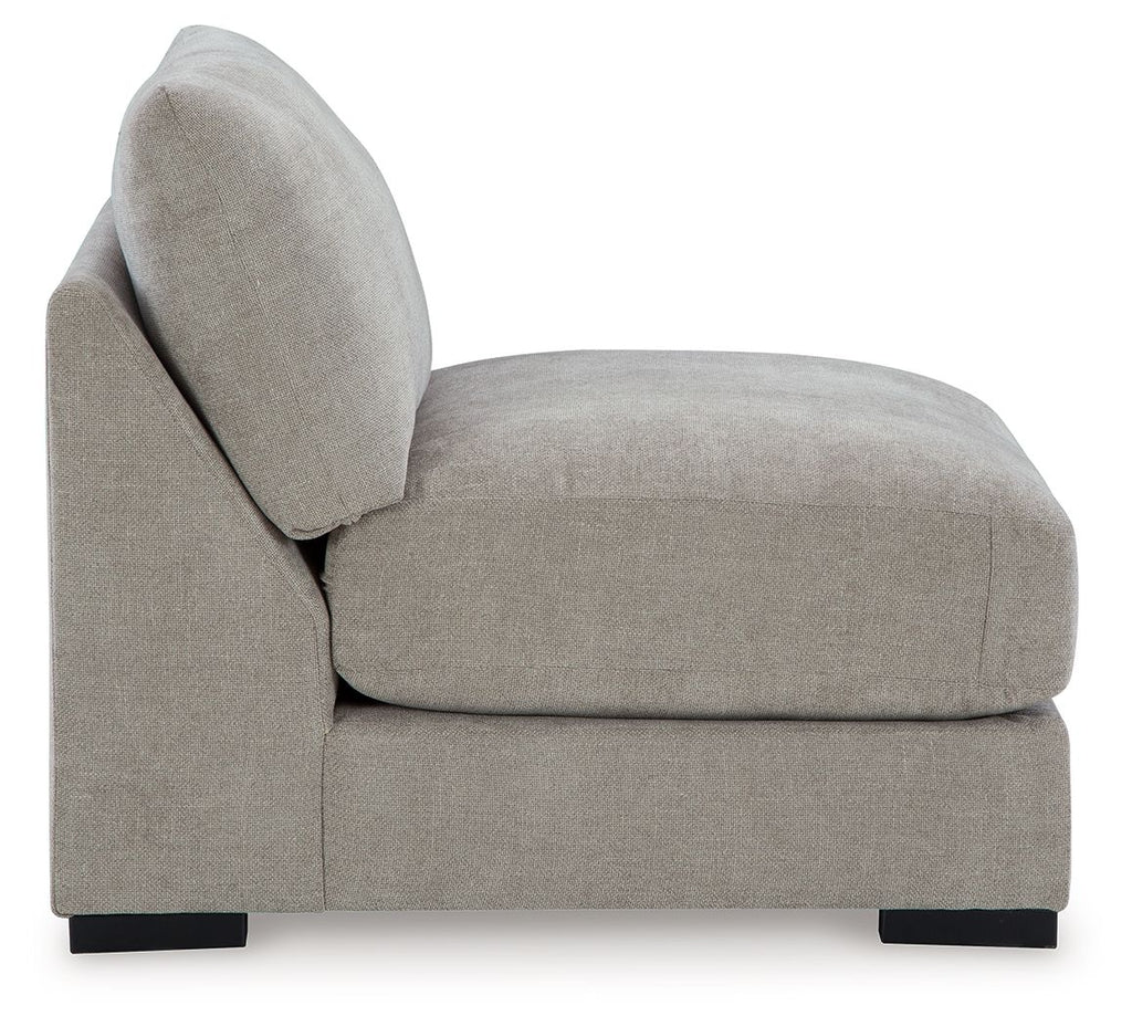 Pebble armless accent chair with rounded back, upholstered seat, black base feet