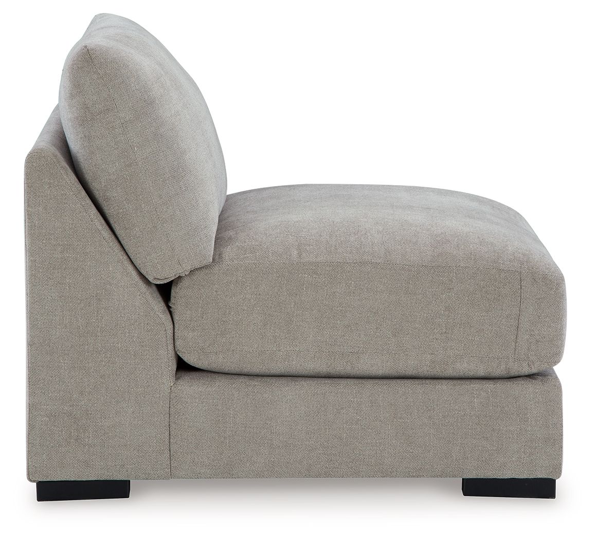 Pebble armless accent chair with rounded back, upholstered seat, black base feet