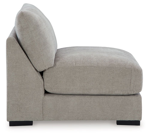 Pebble armless accent chair with rounded back, upholstered seat, black base feet