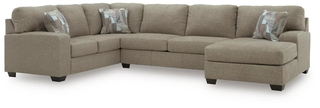 Taupe fabric sectional sofa with chaise corner seats and four back pillows