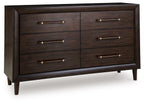 Dark brown dresser with 6 drawers and brass bar handles, front view