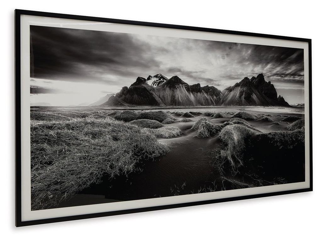 Black-and-white mountain landscape wall art in white mat within black frame