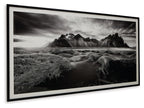 Black-and-white mountain landscape wall art in white mat within black frame