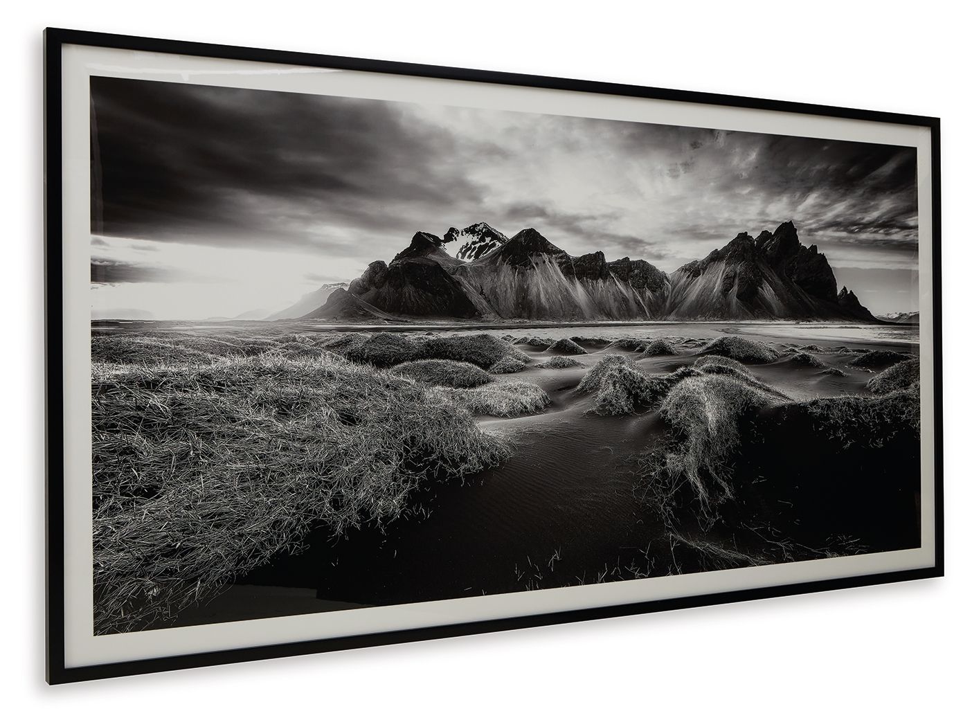 Black-and-white mountain landscape wall art in white mat within black frame