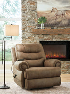 Tan leather-look power lift recliner in living room setting with curved padded arms