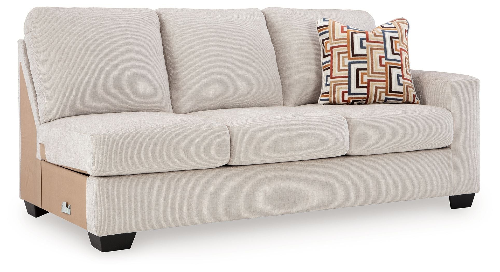 Stone-colored fabric sofa with three seat cushions and patterned throw on right arm