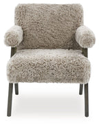 Light gray shag accent chair with rounded arms, thick seat cushion, and dark legs