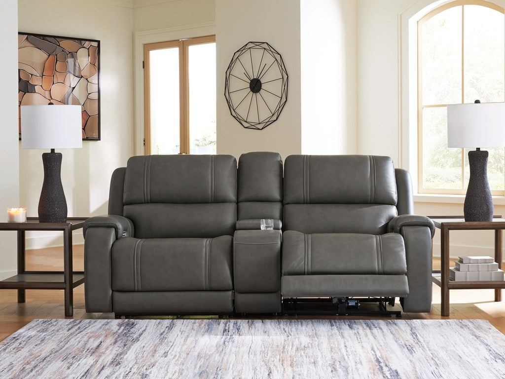 Dark gray power reclining loveseat with three seat sections, padded arms, and recline controls