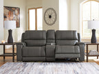Dark gray power reclining loveseat with three seat sections, padded arms, and recline controls