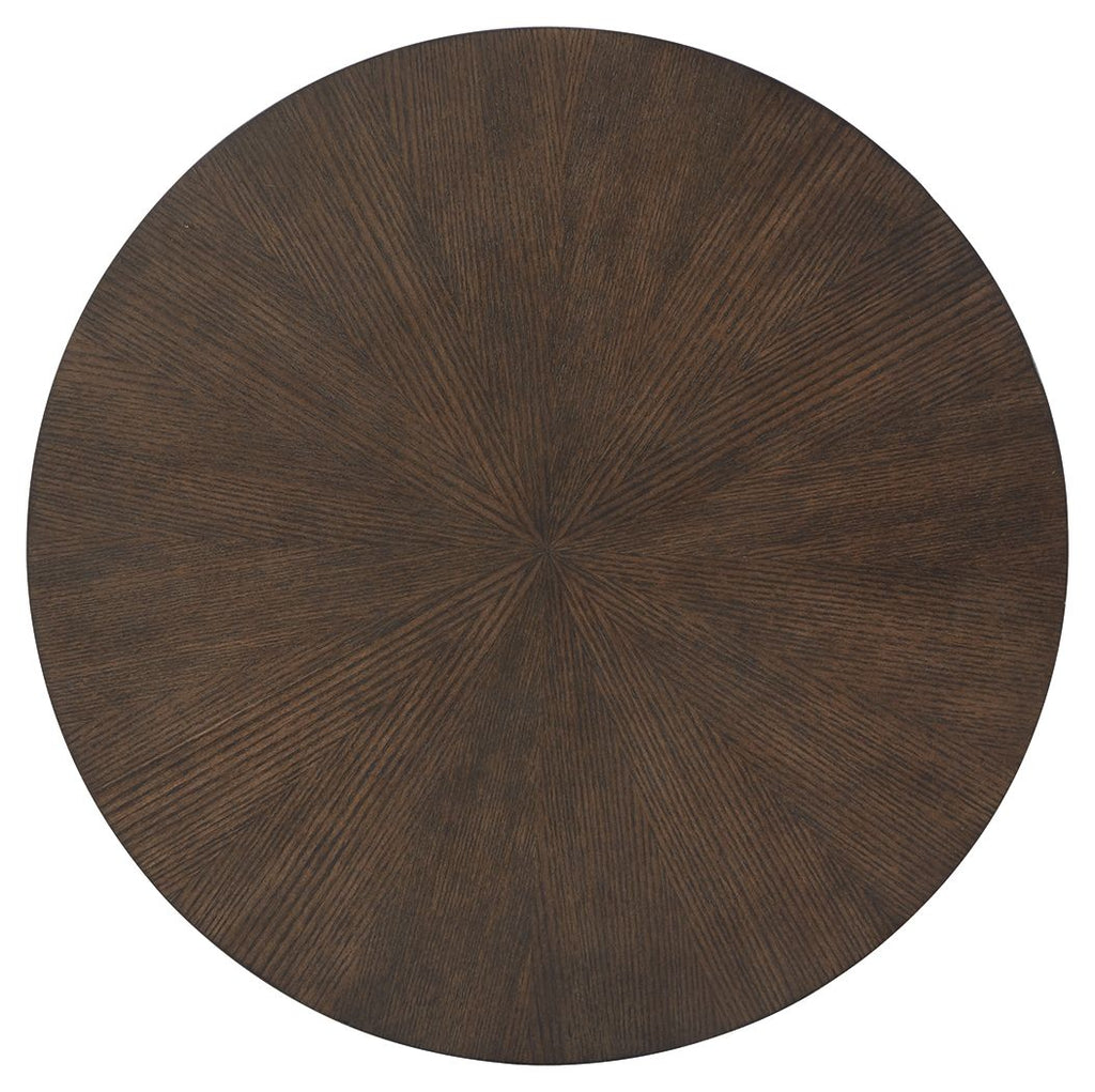 Round dark wood table top with visible radial grain pattern.