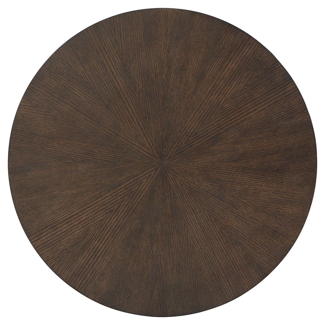 Round dark wood table top with visible radial grain pattern.