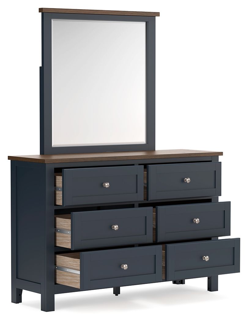 Dark blue dresser with mirror, brown top, six drawers with one open drawer