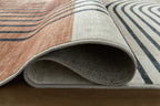 Farrendale washable rug, rolled edge view in beige and dark blue-gray with stripes