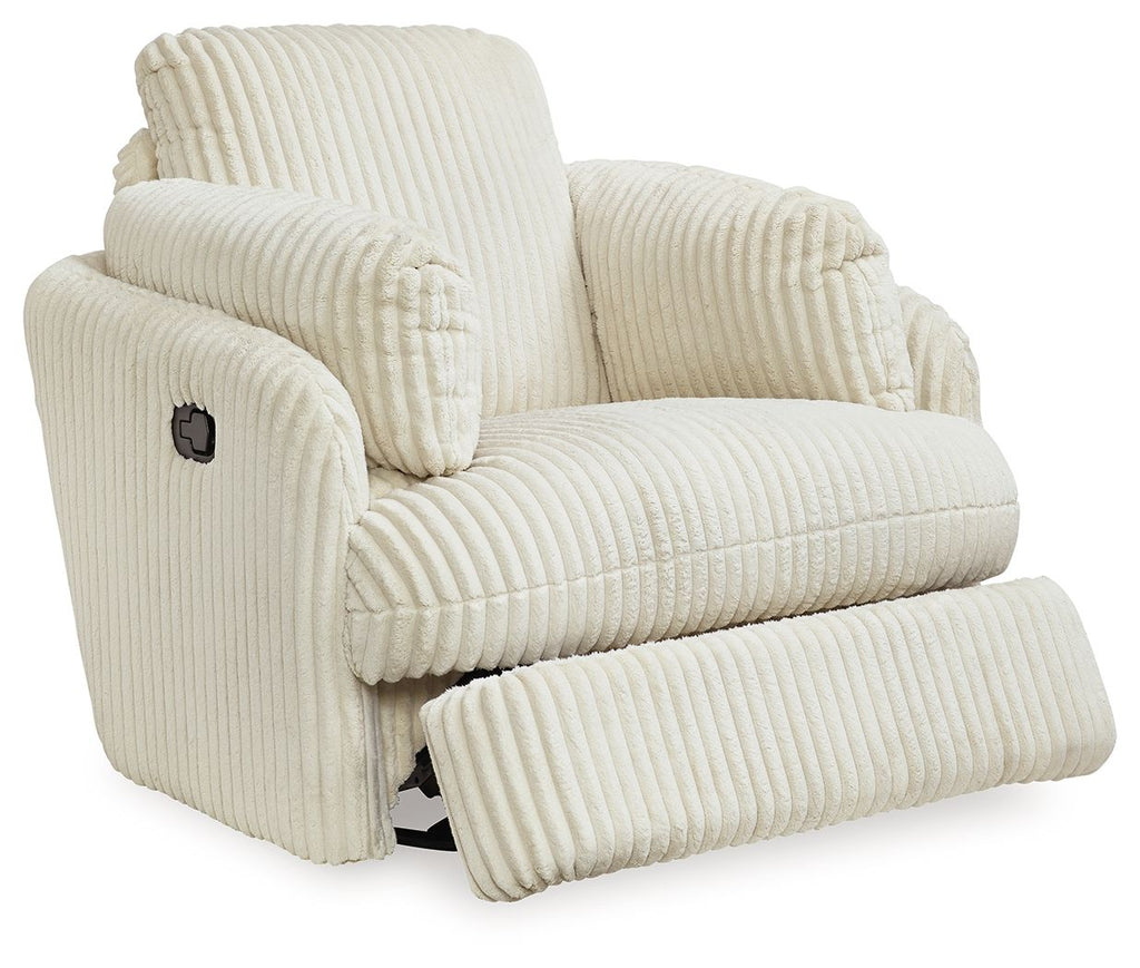 Ivory corduroy recliner with footrest extended and side control panel on arm.