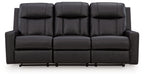 Black reclining sofa with padded tufted back and smooth segmented front seat panels