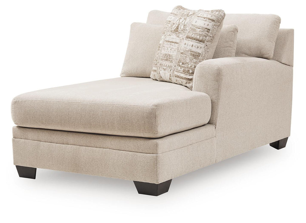 Light beige right-arm corner chaise with boxy seat, dark feet, and patterned cushion