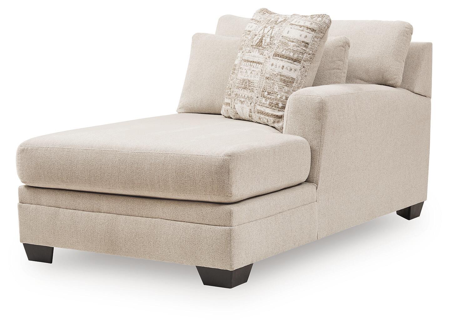 Light beige right-arm corner chaise with boxy seat, dark feet, and patterned cushion