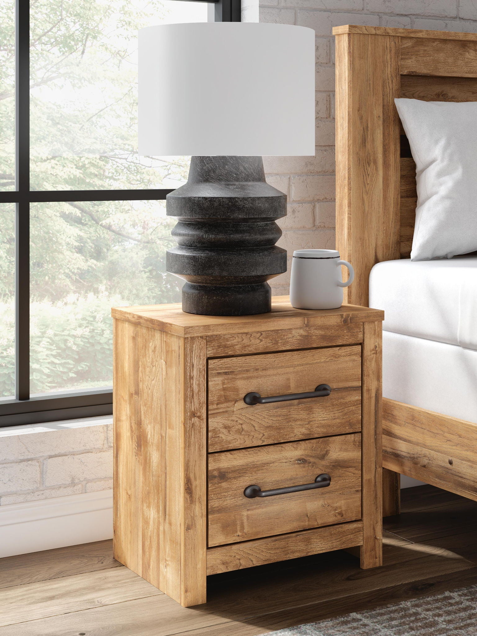 Two-drawer night stand in brown wood with two drawers and black bar handles.