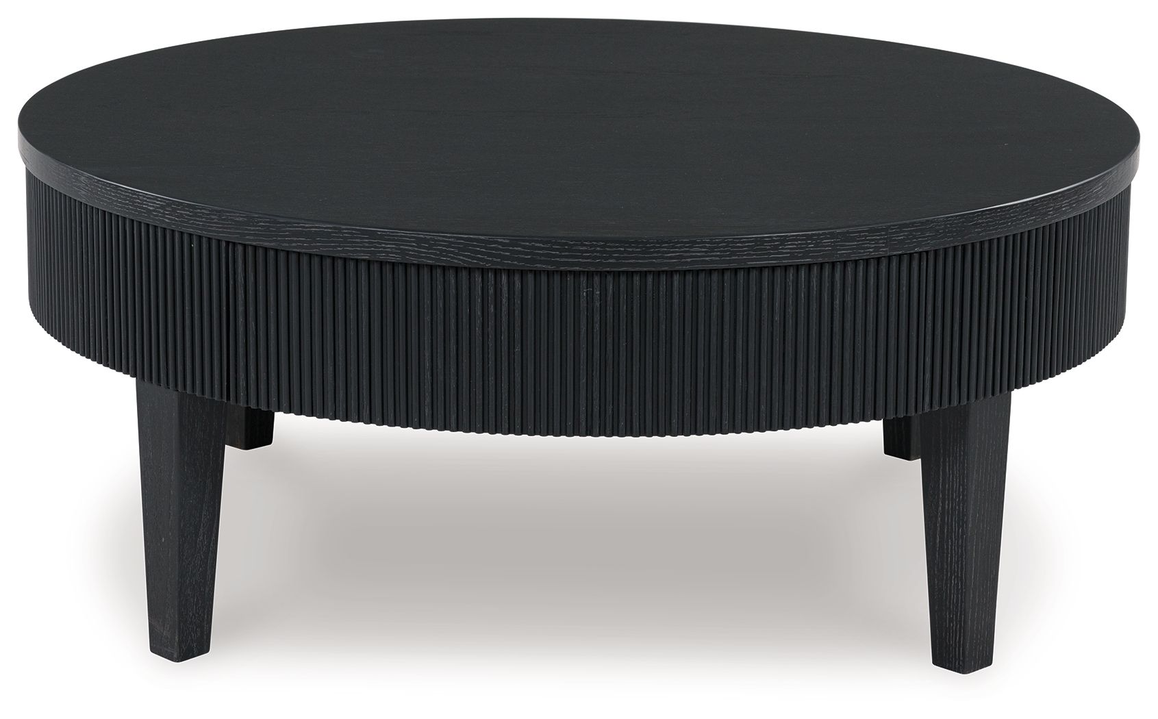 Black round cocktail table with ribbed skirt and four tapered legs