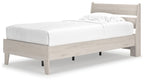 Beige panel platform bed with white mattress and pillows