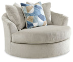Beige oversized swivel accent chair with rounded arms and cushioned seat