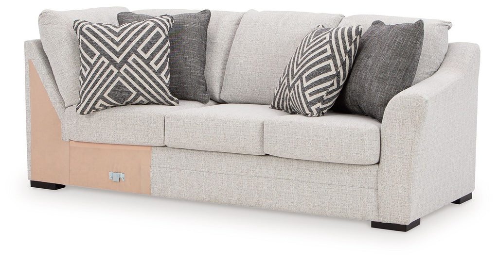 Koralynn Raf sofa with corner wedge in light gray with patterned throw pillows